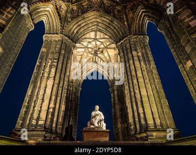 Victorian Gothic Sir Walter Scott monument by Sir John Steell lit up at night, Princes Street, Edinburgh, Scotland, UK Stock Photo