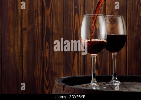 pouring red wine in glass Stock Photo