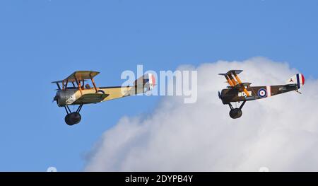 Vintage 1916  Sopwith Pup  and Sopwith Triplane World War 1  aircraft in flight. Stock Photo