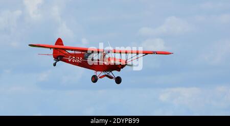 Vintage 1961 Piper Super Cub in flight close up. Stock Photo