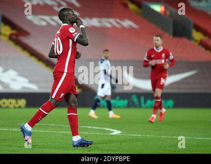Liverpool's Sadio Mane (left) celebrates scoring his side's first goal of the game during the Premier League match at Anfield Stadium, Liverpool. Stock Photo