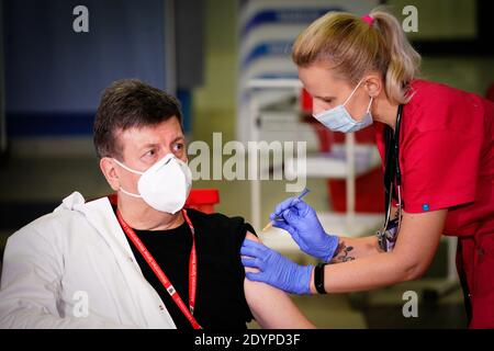 Warsaw, Poland. 27th Dec, 2020. Waldemar Wierzba, director of the Central Clinical Hospital of the Ministry of the Interior, receives coronavirus vaccination in Warsaw, Poland, on Dec. 27, 2020. Credit: Jaap Arriens/Xinhua/Alamy Live News Stock Photo