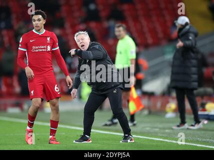 West Bromwich Albion assistant head coach Sammy Lee on the pitch as Liverpool manager Jurgen Klopp appeals to the linesman during the Premier League match at Anfield Stadium, Liverpool.