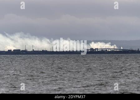 View from Southend on Sea, Essex, UK, across the Thames Estuary to Kent, with Sheppey Crossing, Sheerness and Minster visible. Power station steam Stock Photo