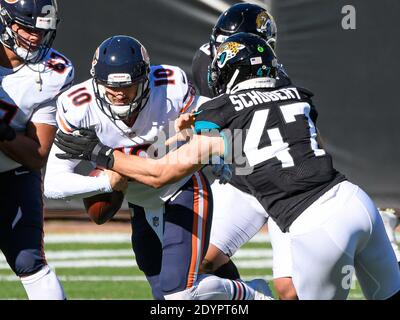 Jacksonville, FL, USA. 27th Dec, 2020. Chicago Bears quarterback Mitchell Trubisky (10) fumbles the ball and sacked by Jacksonville Jaguars linebacker Joe Schobert (47) during 1st half NFL football game between the Chicago Bears and the Jacksonville Jaguars at TIAA Bank Field in Jacksonville, Fl. Romeo T Guzman/CSM/Alamy Live News Stock Photo