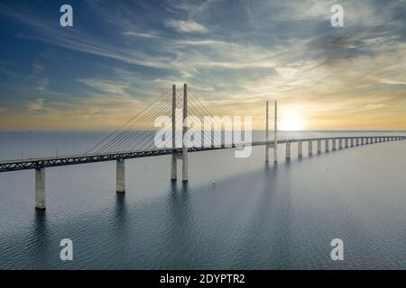A mesmerizing aerial view of the bridge between Denmark and Sweden under the cloudy sky Stock Photo
