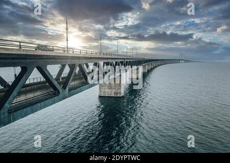 A mesmerizing aerial view of the bridge between Denmark and Sweden under the cloudy sky Stock Photo