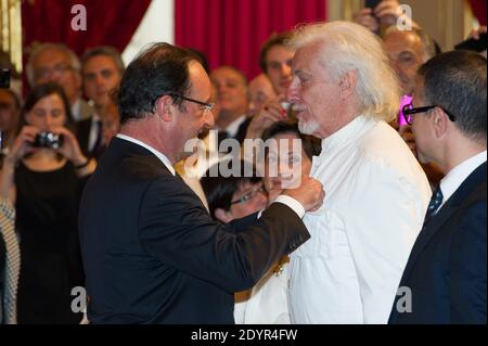 French President Francois Hollande awards singer Hugues Aufray with the Order of Chevalier de la Legion d'Honneur during a ceremony at the Elysee Palace in Paris, France on July 3, 2013. Photo by Pierre Villard/Pool/ABACAPRESS.COM Stock Photo