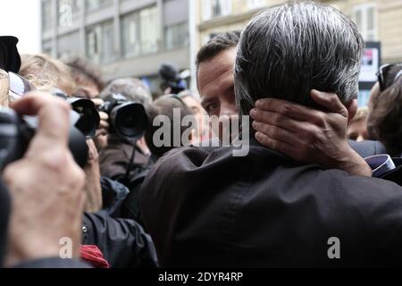 Leader of the left-wing Front de Gauche (Left Front) party Jean-Luc Melenchon kisses Former French trader Jerome Kerviel at the Conseil des Prud'hommes Labour Court to support him against the Societe Generale bank about his dismissal for serious misconduct, in Paris, France on July 4, 2013. Photo by Stephane Lemouton/ABACAPRESS.COM Stock Photo