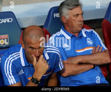 Real Madrid's Italian coach Carlo Ancelotti and his assistant French Zinedine Zidane sit before the Pre Season soccer match, Olympique Lyonnais Vs Real Madrid at Gerland Stadium in Lyon, France on July 24, 2013. The match ended in a 2-2. Photo by Vincent Dargent/ABACAPRESS.COM Stock Photo