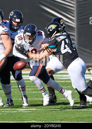 Jacksonville, FL, USA. 27th Dec, 2020. Chicago Bears quarterback Mitchell Trubisky (10) fumbles the ball while being tackled by Jacksonville Jaguars linebacker Joe Schobert (47) during 1st half NFL football game between the Chicago Bears and the Jacksonville Jaguars at TIAA Bank Field in Jacksonville, Fl. Romeo T Guzman/CSM/Alamy Live News Stock Photo