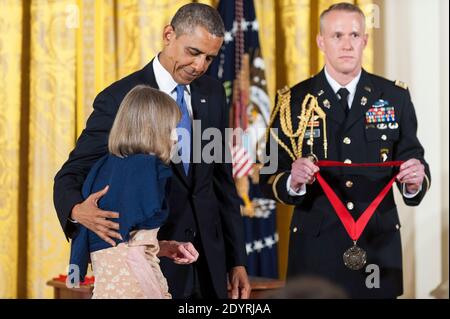President Obama presents a 2012 National Humanities Medal to author Joan Didion, during a ceremony in the East Room of the White House on July 10, 2013 in Washington, DC. Didion is recognized for her mastery of style in writing. Photo by Pete Marovich/Pool/ABACAPRESS.COM) Stock Photo