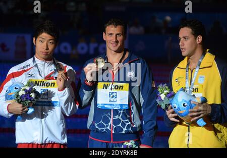 (L-R) Silver medal winner Kosuke Hagino of Japan, Gold medal winner Ryan Lochte of the USA and Bronze medal winner Thiago Pereira of Brazil celebrate on the podium after the Swimming Men's Individual Medley 200m Final during the 15th FINA Swimming World Championships at Montjuic Municipal Pool in Barcelona, Spain on August 1, 2013. Photo by Christian Liewig/ABACAPRESS.COM Stock Photo