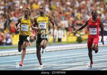 Usain Bolt of Jamaica (C) wins the 100m final ahead of Justin Gatlin (R) of the US at the 14th IAAF World Championships in Athletics at Luzhniki Stadium in Moscow, Russia, on August 11, 2013. At Left Jamaica's Kemar Bailey-Cole. Photo by Giuliano Bevilacqua/ABACAPRESS.COM Stock Photo