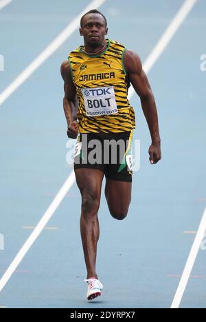 Usain Bolt of Jamaica (C) wins the 100m final ahead of Justin Gatlin (R) of the US at the 14th IAAF World Championships in Athletics at Luzhniki Stadium in Moscow, Russia, on August 11, 2013. At Left Jamaica's Kemar Bailey-Cole. Photo by Giuliano Bevilacqua/ABACAPRESS.COM Stock Photo