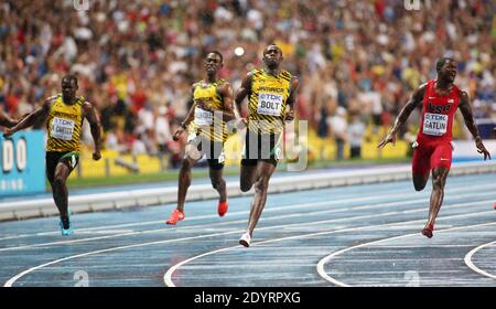 Usain Bolt of Jamaica (C) wins the 100m final ahead of Justin Gatlin (R) of the US at the 14th IAAF World Championships in Athletics at Luzhniki Stadium in Moscow, Russia, on August 11, 2013. At Left Jamaica's Kemar Bailey-Cole. Photo by Giuliano Bevilacqua/ABACAPRESS.COM Stock Photo