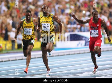 Usain Bolt of Jamaica (C) wins the 100m final ahead of Justin Gatlin (R) of the US at the 14th IAAF World Championships in Athletics at Luzhniki Stadium in Moscow, Russia, on August 11, 2013. At Left Jamaica's Kemar Bailey-Cole. Photo by Giuliano Bevilacqua/ABACAPRESS.COM Stock Photo