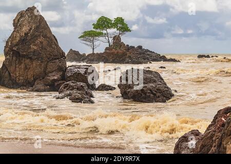 Ghana beach with rocks and golden sea located in Axim West Africa also called the gold coast Stock Photo