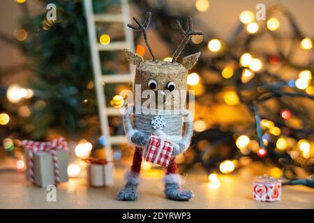 Creative winter scene concept, creative christmas concept, Cork deer figure celebrating Boxing Day, Christmas scene, Scandinavian patterns, Christmas Stock Photo