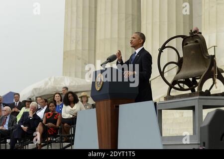 US President Barack Obama (R) delivers remarks in front of a freedom bell during the 'Let Freedom Ring' commemoration event, as (back L to R); former US President Jimmy Carter, former US President Bill Clinton, First Lady Michelle Obama and Oprah Winfrey look on, at the Lincoln Memorial in Washington DC, USA, 28 August 2013. The event was held to commemorate the 50th anniversary of the 28 August 1963 March on Washington led by the late Dr. Martin Luther King Jr., where he famously gave his 'I Have a Dream' speech. Photo by Michael Reynolds/Pool/ABACAPRESS.COM Stock Photo