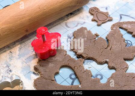 Closeup of the kitchen table with Christmas gingerbread in preparation Stock Photo