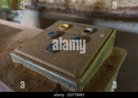 Industrial remote control panel with buttons covered in a layer of dust Stock Photo