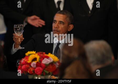 President Barack Obama joins in a toast at the Delegates Luncheon after addressing the United Nations 68th General Assembly.New York City, NY, USA, September 24, 2013. Photo by Allan Tannenbaum/Pool/ABACAPRESS.COM Stock Photo