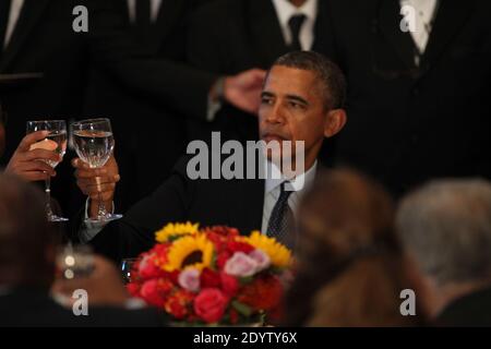 President Barack Obama joins in a toast at the Delegates Luncheon after addressing the United Nations 68th General Assembly.New York City, NY, USA, September 24, 2013. Photo by Allan Tannenbaum/Pool/ABACAPRESS.COM Stock Photo
