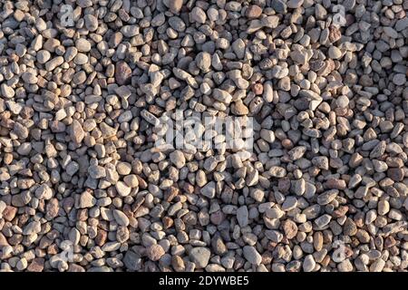 light small pebbles background texture with place for text Stock Photo