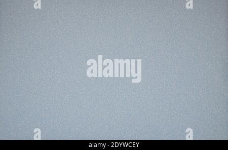 Monochrome pale blue background with small silvery sparkles. Background, texture. Stock Photo