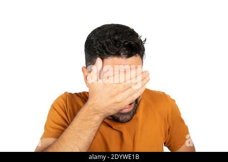 Portrait of young man looking scared. Stock Photo