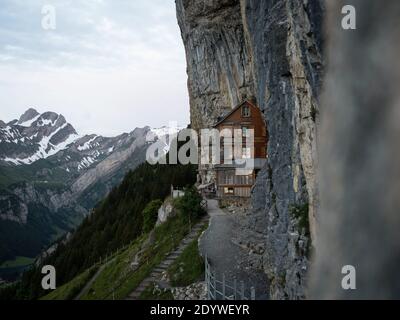 Famous guesthouse Aescher-Wildkirchli built into limestone cliff wall Alpstein alpine mountains Appenzell Innerrhoden Switzerland Stock Photo