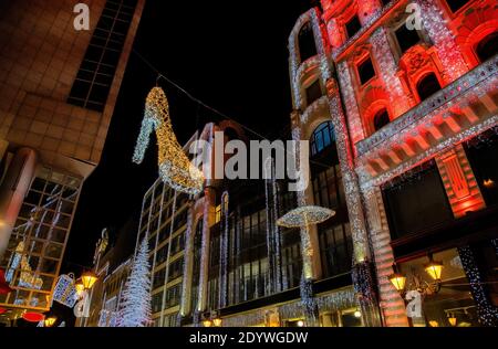 Christmas illuminated glittering decoration and decorative building with led strip lighting in downtown Budapest, Hungary. Stock Photo