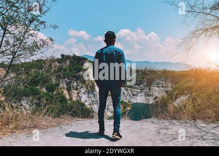 Man standing on rock mountain at sky view background copy spec,travel Stock Photo
