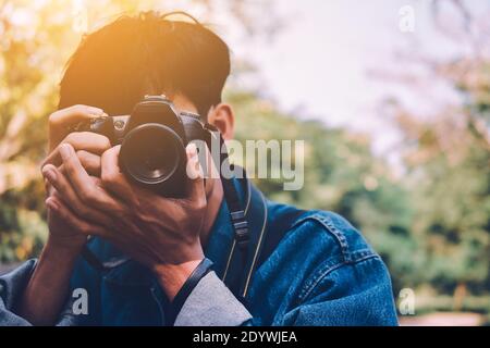 Man Holding Camera Indoor Pose Camera Photo Background And Picture For Free  Download - Pngtree