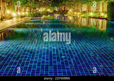 Open swimming pool in evening Stock Photo