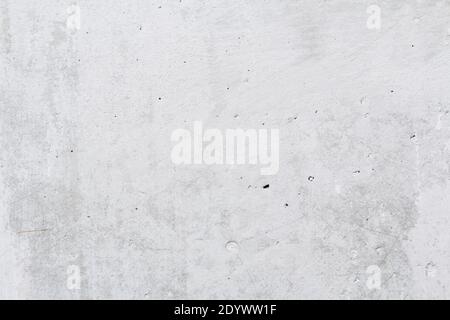 Gray concrete wall peeled of wallpaper. Concrete background. Stock Photo