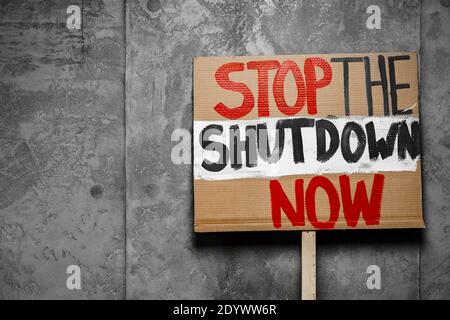 Protestive placard against coronavirus lockdowns against wall Stock Photo