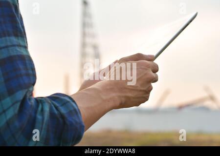 Close up Engineer Construction holding tablet checking work estate technology Stock Photo