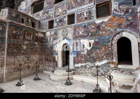 Christian frescoes cover the entrance wall into the Rock Church at  Sumela Monastery. Sumela is located in the Trabzon Province of Turkey. Stock Photo