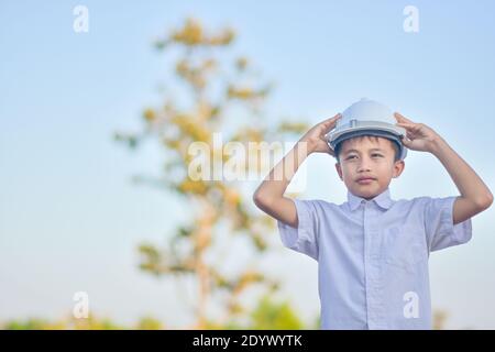 Boy With Helmet hardhat safety Engineer concept Stock Photo