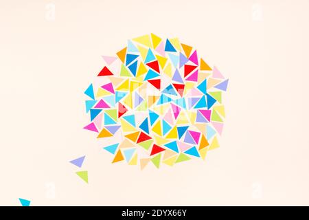 Colourful paper mosaic on light background. Abstract wallpaper. Geometric background. Stock Photo