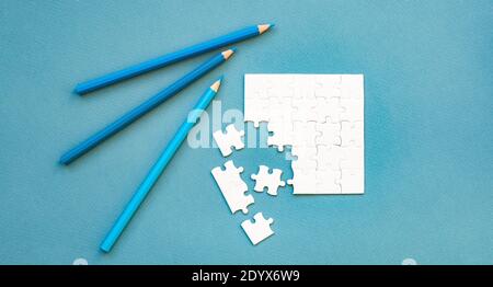 Small disassembled white square puzzle Stock Photo - Alamy