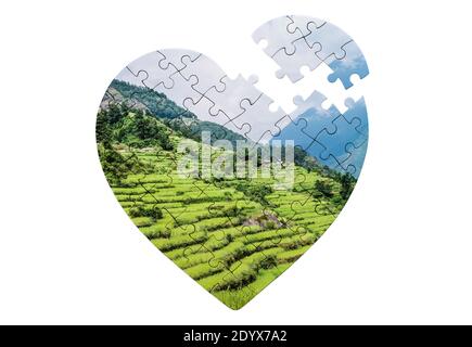 Heart shaped jigsaw puzzle with print of nature Stock Photo