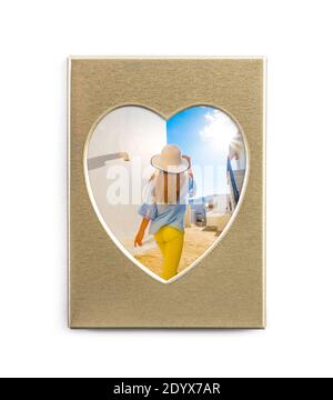Cute summer photo in golden frame in shape of heart isolated on white background Stock Photo