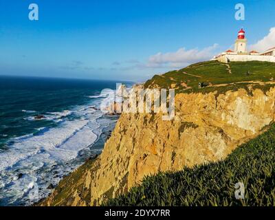 Cabo da Roca, Portugal. Lighthouse and cliffs over Atlantic Ocean, the most westerly point of the European mainland. Stock Photo