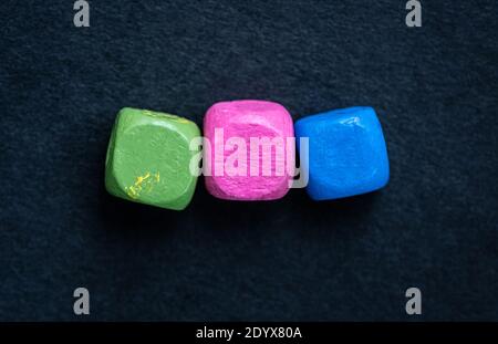 Close up view of bright cubes on dark blue background Stock Photo