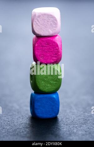Stack of bright wooden beads on gray background Stock Photo