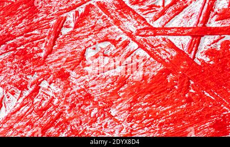 Red paint on textured wooden wall Stock Photo