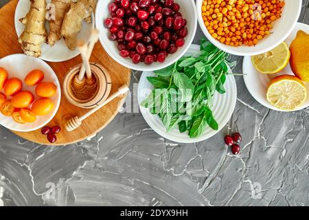 Trendy Virus protection food, coronavirus, immunity concept. Assortment product of rich in antioxidants and vitamins sources on grey background,  Heal Stock Photo